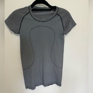 Lululemon swiftly tech short sleeve. Size 6. Black with white stripes.